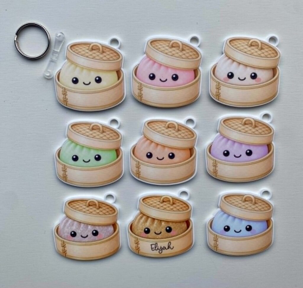 Nine pastel dumpling keyrings in assorted colours, including one personalised with Elijah