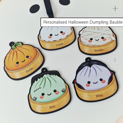 Personalised Halloween dumpling baubles on black acrylic