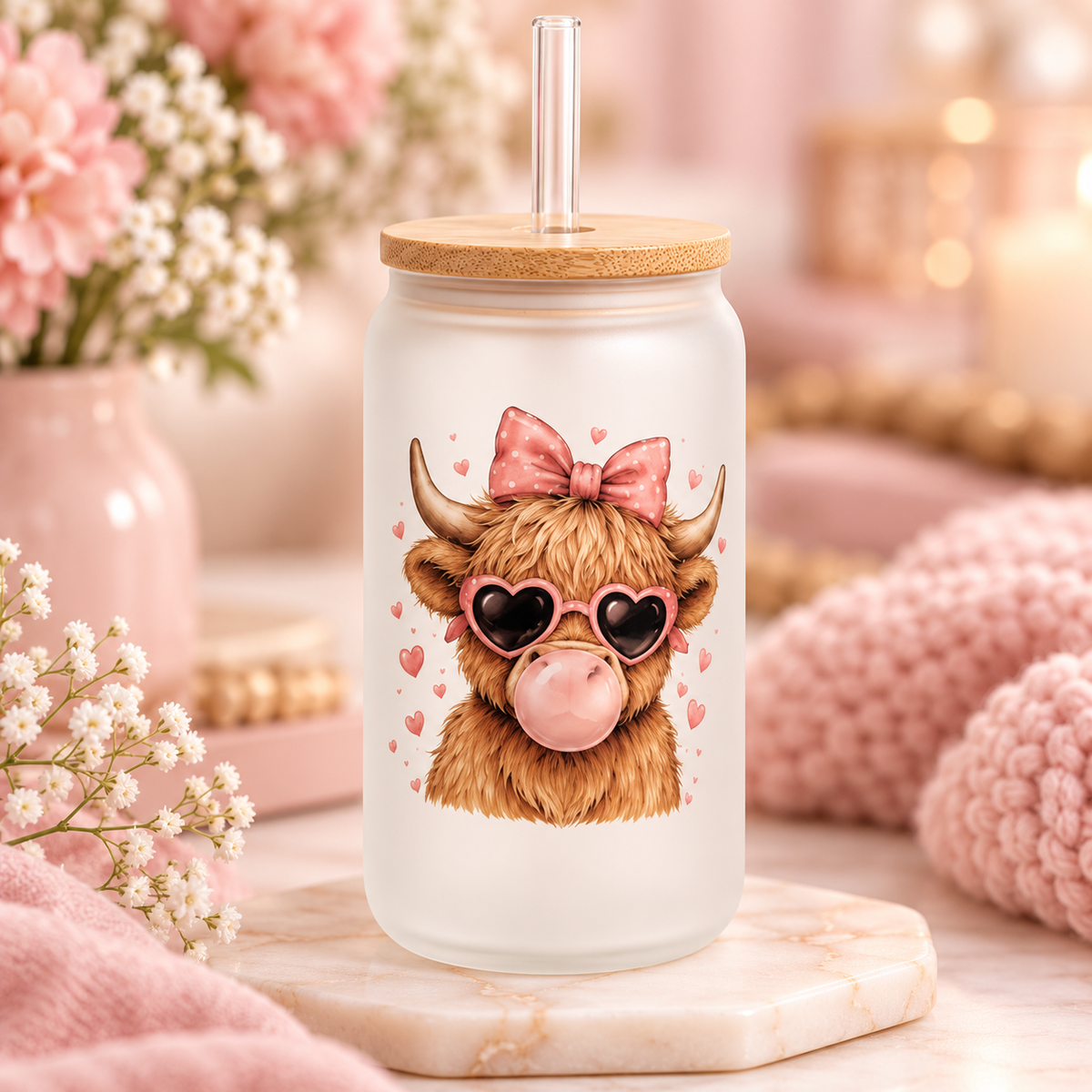 Bubblegum Highland Cow glass can with bamboo lid and straw in a soft pink setting