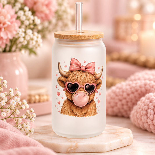 Bubblegum Highland Cow glass can with bamboo lid and straw in a soft pink setting