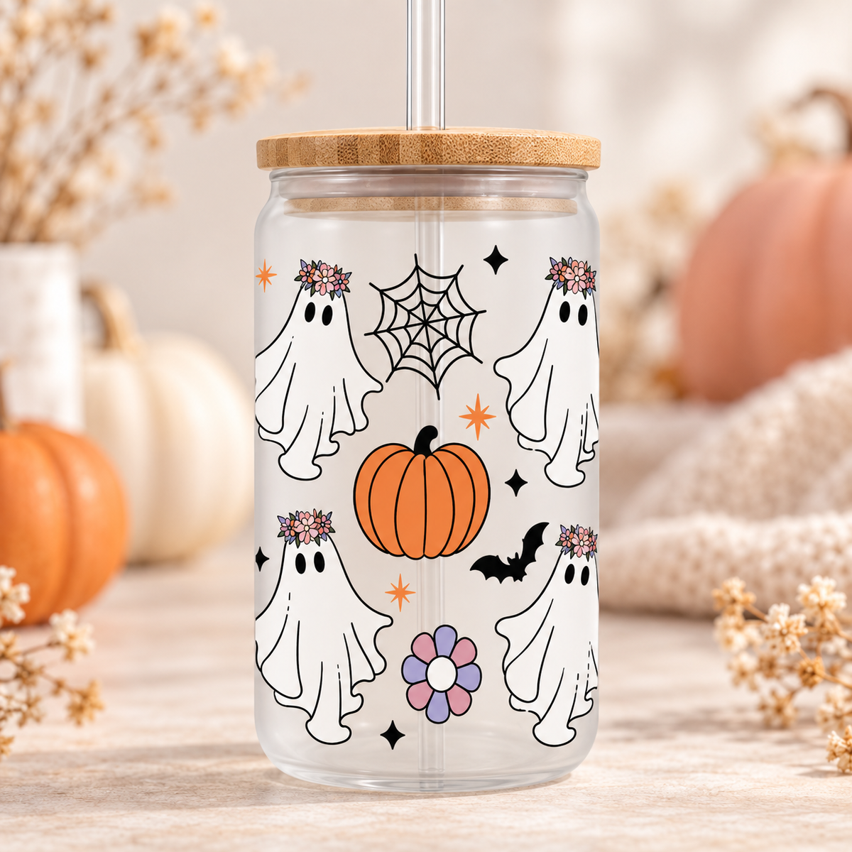 Floral Ghosts Halloween glass can with bamboo lid and straw in a soft autumn setting