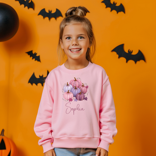 Child wearing a personalised Pretty Pastel Pumpkins Halloween sweatshirt