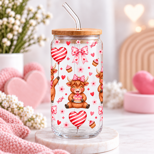 Highland cow glass can with bamboo lid and straw in a soft pink styled setting