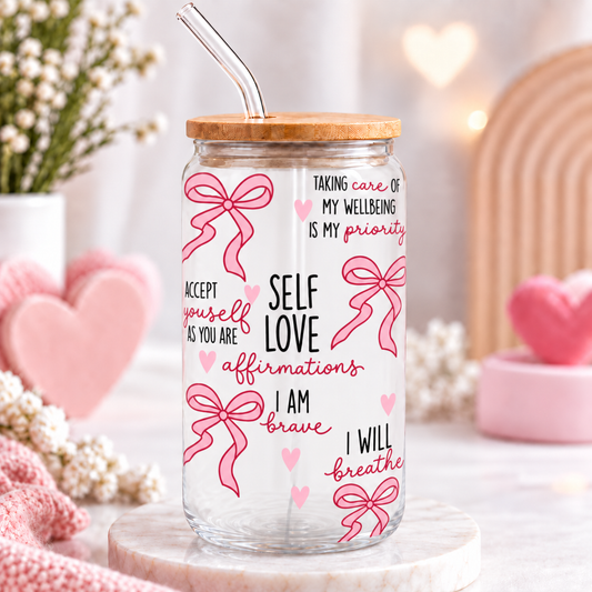 Self Love glass can with pink bows and affirmations in a soft pink styled setting